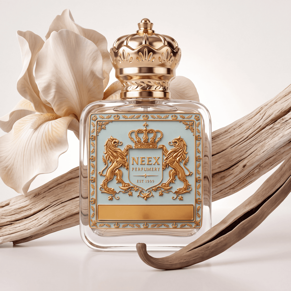 Neex Perfumery perfume bottle featuring an ornate gold crown cap and a light pastel blue crest label with gold metallic detailing, framed by a delicate white iris bloom, weathered driftwood, and a dark, dried vanilla pod over a clean off-white background.   