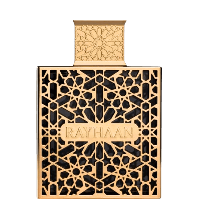 Frontal view of a square dark glass bottle encased in an intricate metallic gold Arabic geometric lattice cage, centered with a gold plaque engraved "RAYHAAN" and topped with a matching geometric patterned gold cap.
